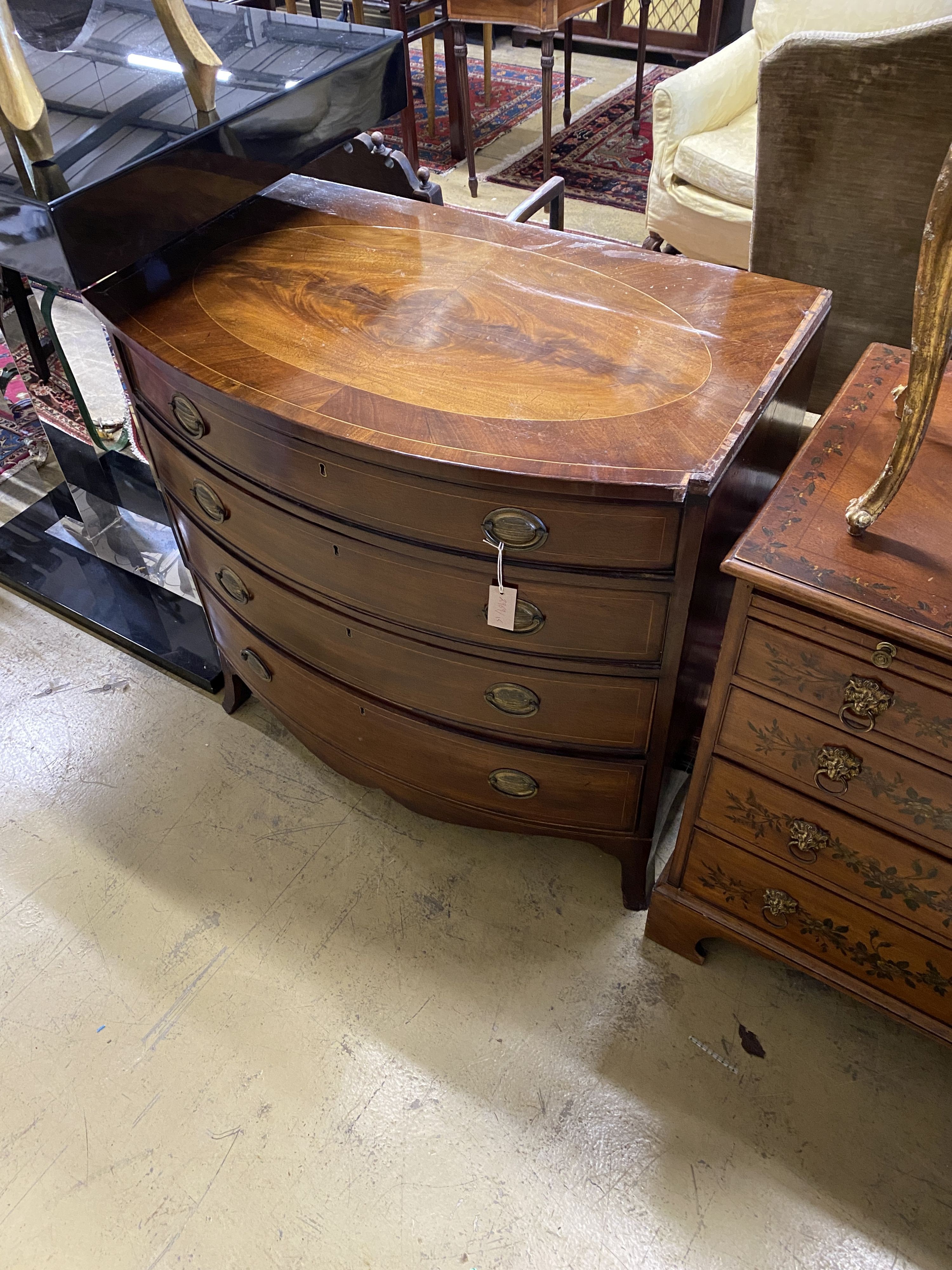 A Regency inlaid mahogany bow front chest of four drawers, width 92cm, depth 57cm, height 91cm